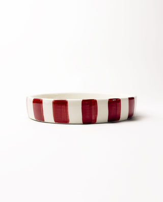 Ceramic Christmas plate with red stripes on a white background