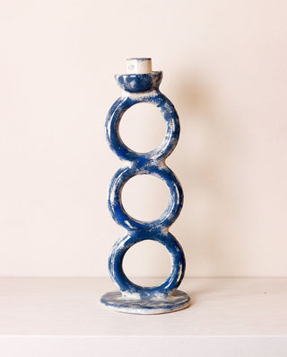 Blue ceramic candle holder with three circular tiers 