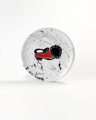 Round Greek handcrafted plate with tsarouch design and text on a white background