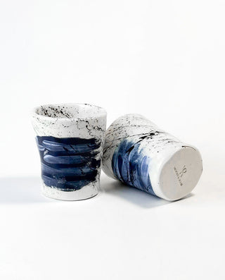Two handcrafted GREEK ceramic cups with blue and white design on a white background