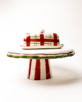 Decorative ceramic cake stand with red and green stripes on a white background