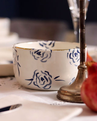 White ceramic bowl with blue floral patterns on a table setting