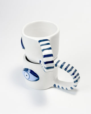 WHITE CLAY CERAMIC MUGS WITH STRIPED HANDLE AND BLUE EYE PATTERN