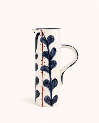 White handmade ceramic pitcher with blue botanical hand-painted design
