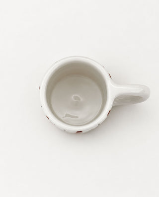 handmade burgundy check ceramic mug with a rounded handle, top view