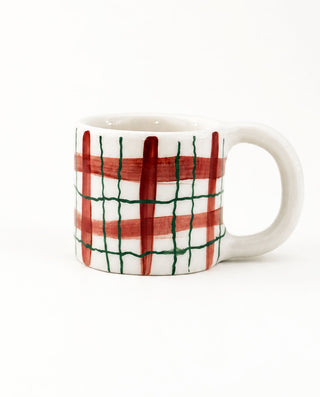 Handmade burgundy check ceramic mug with a rounded handle, front view