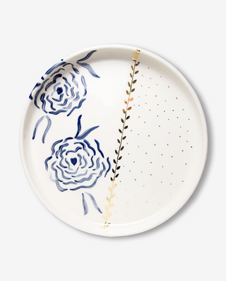 A ceramic serving platter with a royal blue floral pattern and gold accents on the edges.