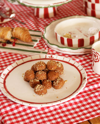 Dessert on a plate with a red and white checkered tablecloth