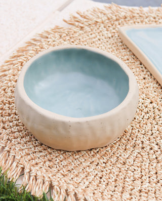 handcrafted ceramic bowl with a sandy appearance