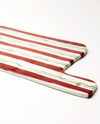 Festive ceramic serving board with red and green stripes