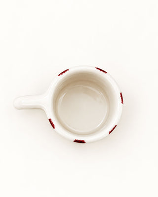 Contemporary handmade ceramic mug with bold red grid design, crafted in Greece