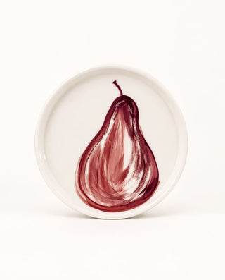 Hand-painted ceramic dinner plate with burgundy pear illustration from the POMONA Collection